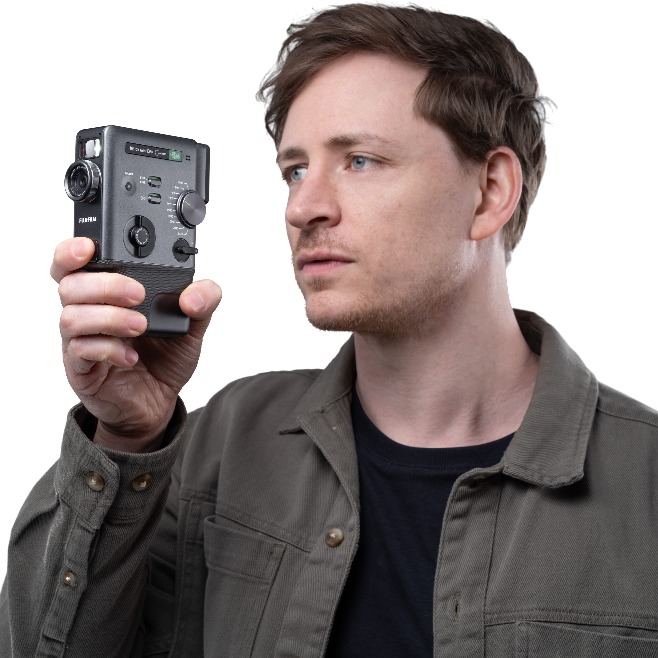 (High res) instax mini Evo Cinema - Promotional images - 17 Holding Camera Looking At LCD Screen_3997- (1-1)